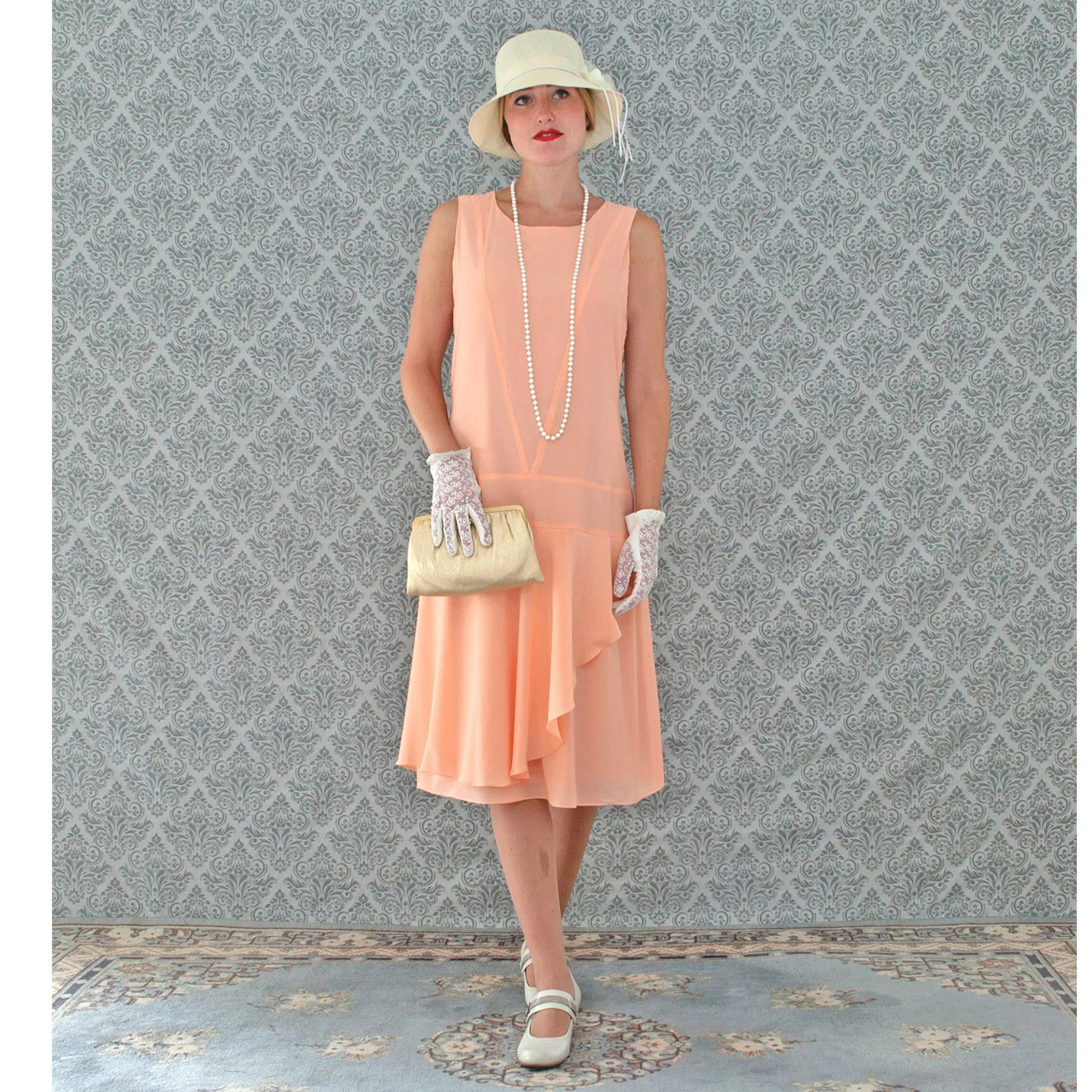 Peach 1920s chiffon dress with ruffled skirt detail