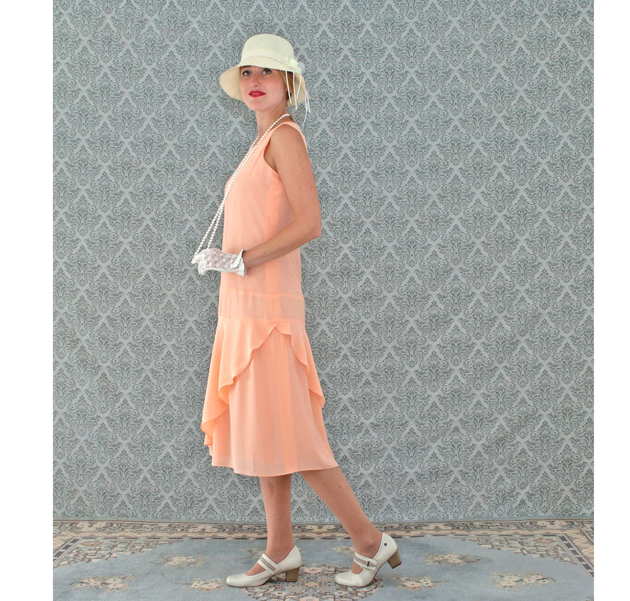 Peach 1920s chiffon dress with ruffled skirt detail